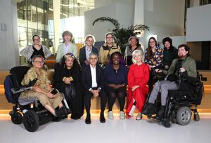A group of people (the Liberty Advisory Group 2025) in a semi-circle