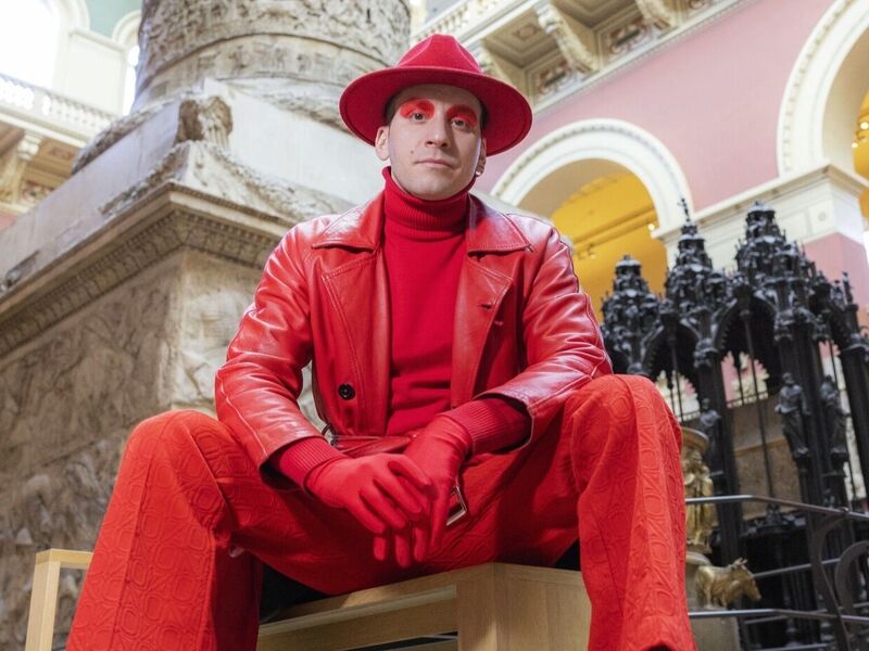 Luca sits on a stall