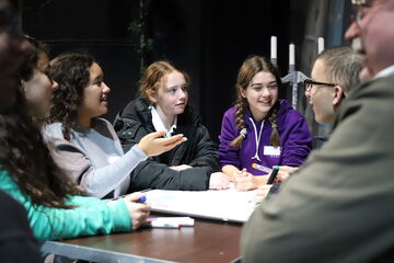 group of young people in discussion