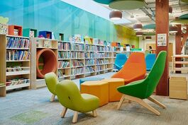 green chairs, books, open soace