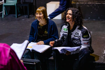 two female actors in the rhearsal room