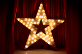 A Lit Up Star On A Stage