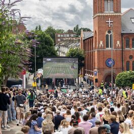 Large screen showing mens tennis finals