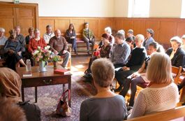 Image of people in peaceful surrounds of the Quaker Meeting House 