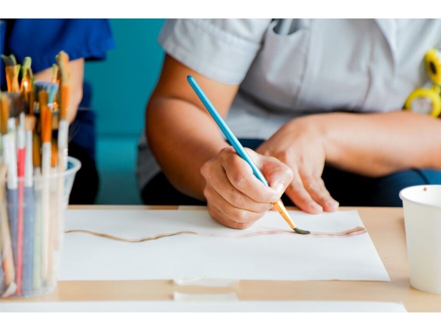 NHS staff member at St George's hospital taking part in a painting workshop 