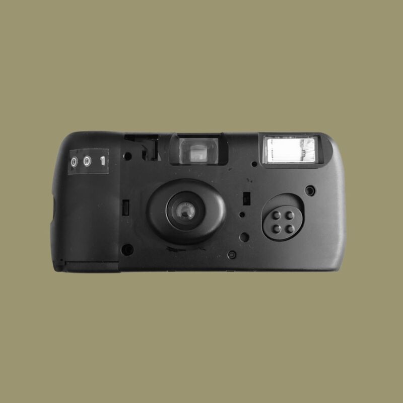 a black disposable camera on a olive green background