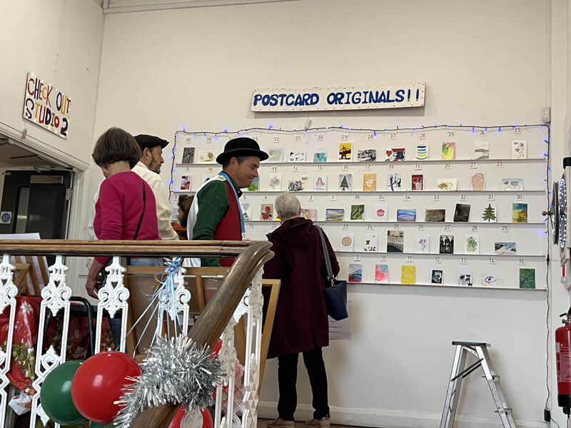 PSAD Christmas show previous years, showing the Original Postacards wall