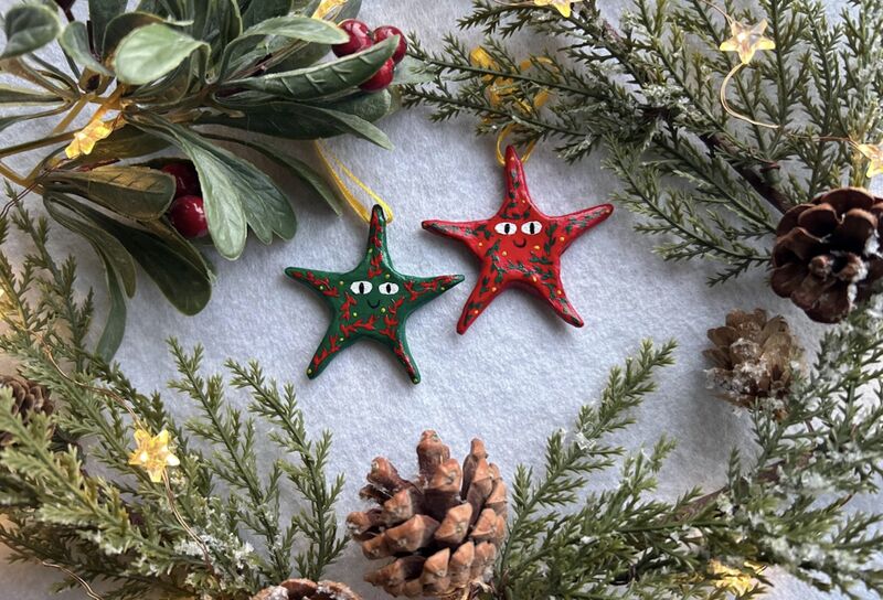 Two small colourful star tree decorations