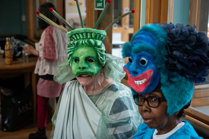 Two masked participants